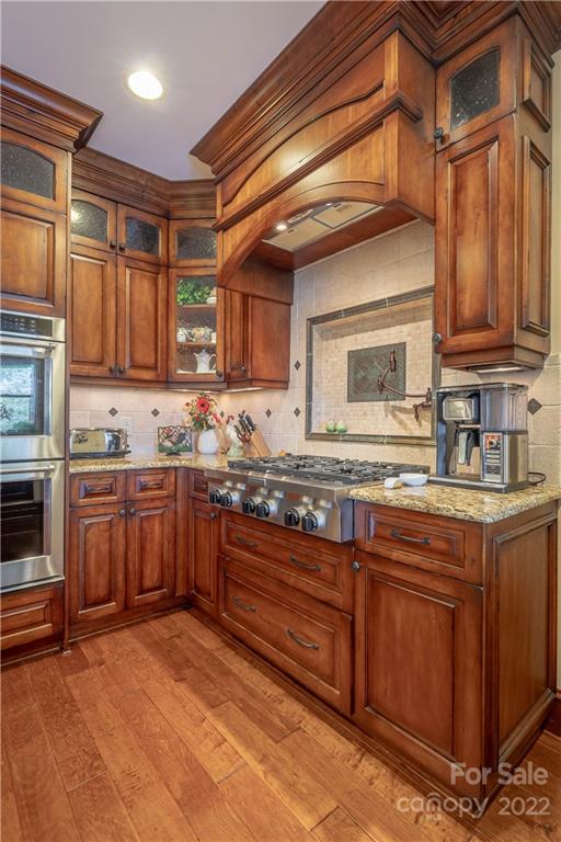 1849 Southpointe Drive Morganton, NC 28655 - Photo 8 of 48 a kitchen with stainless steel appliances granite countertop a stove sink and cabinets