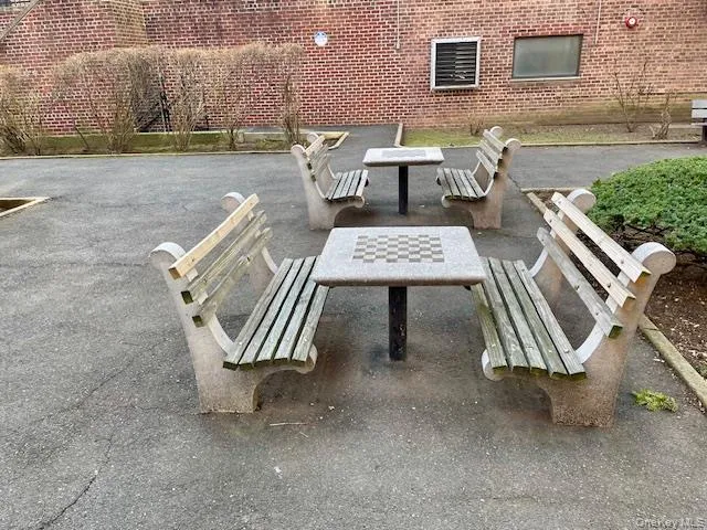 a view of a patio with couple of chairs