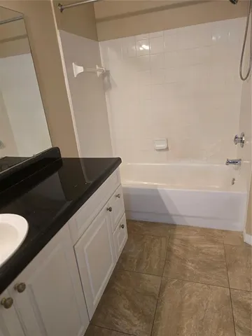 a bathroom with a sink a vanity and a mirror