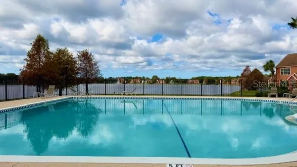 a view of swimming pool from a balcony