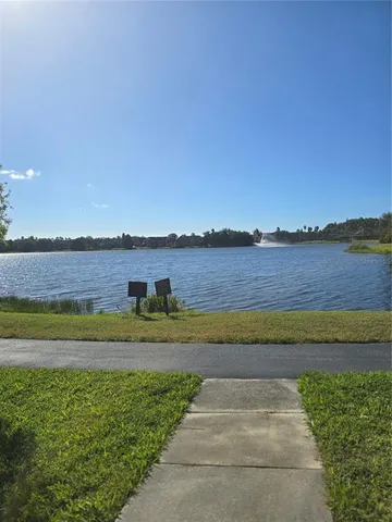 a view of a lake with a big yard