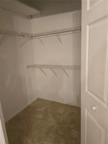a view of an empty walk in closet