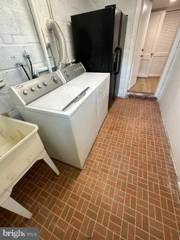 a bathroom with a sink and a washing machine