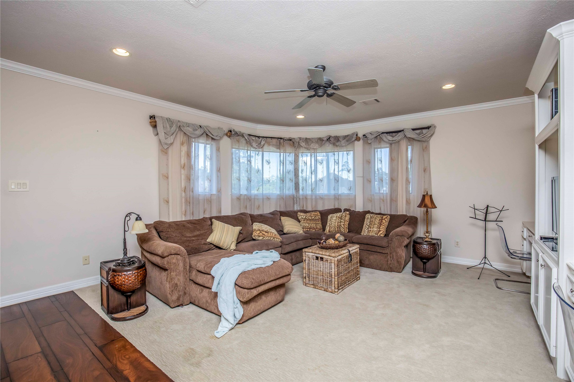 25219 Hideaway Run Drive Spring, TX 77389 - Photo 37 of 45 a living room with furniture and a chandelier