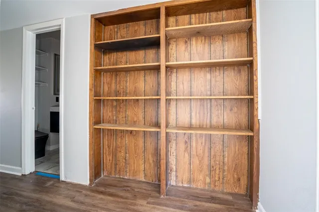 a kitchen with a sink and a mirror