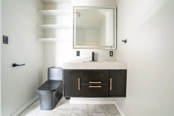 a view of a livingroom with a ceiling fan and window