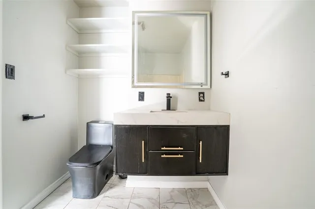 a view of a livingroom with a ceiling fan and window