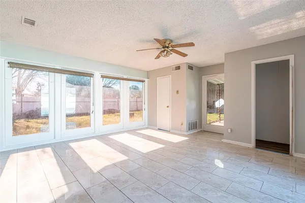 a view of a porch with wooden floor
