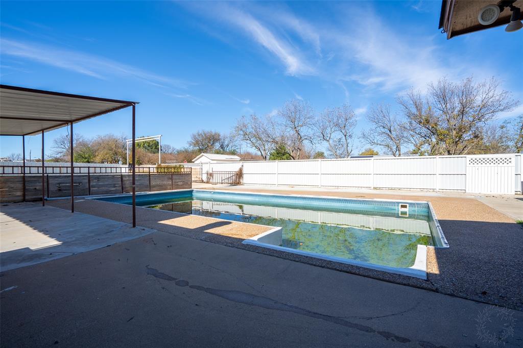 601 Henry Street Dublin, TX 76446 - Photo 3 of 40 a view of a swimming pool with a yard