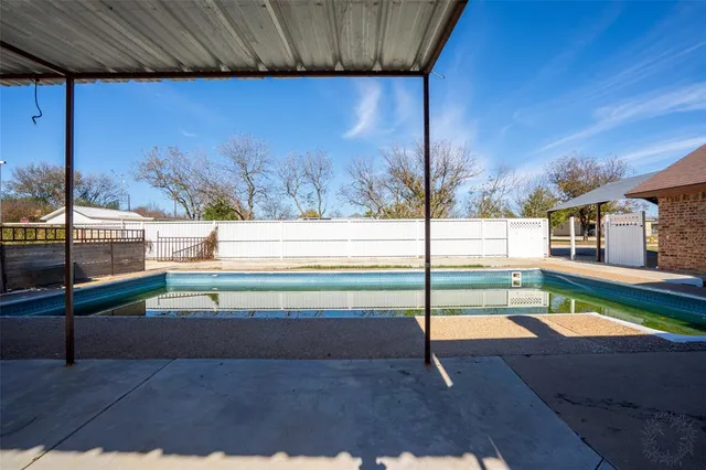 a view of a house with a swimming pool