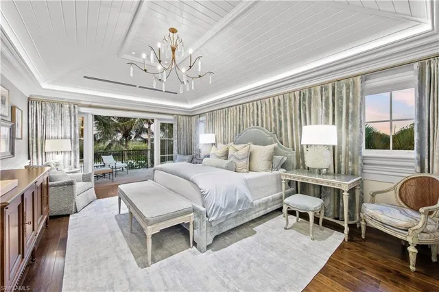 a view of a chairs and table in patio with a lake view