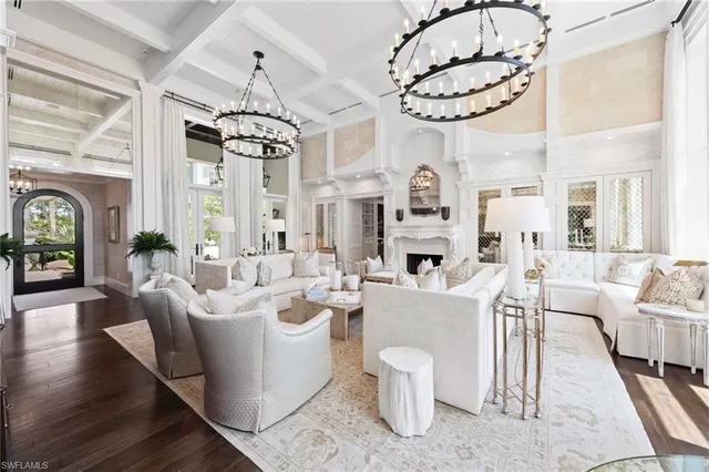 a view of a dining room with furniture wooden floor and chandelier