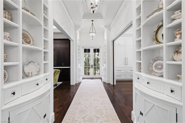 a bathroom with a toilet a sink a glass door a shower a mirror and vanity