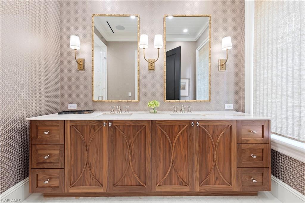 3675 Gordon Drive Naples, FL 34102 - Photo 26 of 50 a bathroom with a sink vanity and a mirror