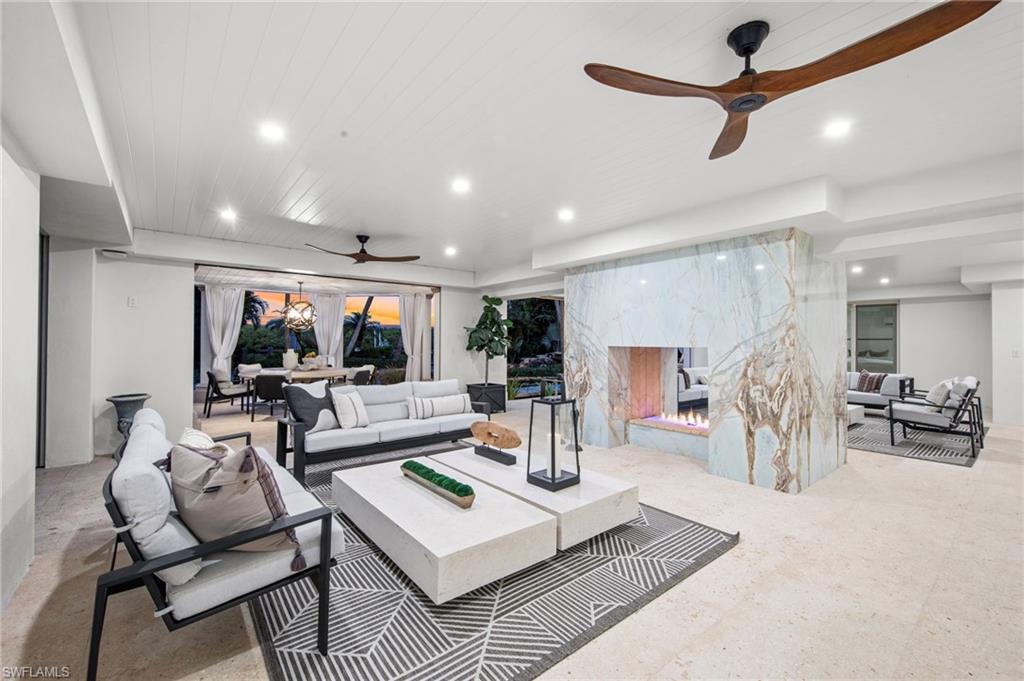 3675 Gordon Drive Naples, FL 34102 - Photo 35 of 50 a living room with furniture and a large window