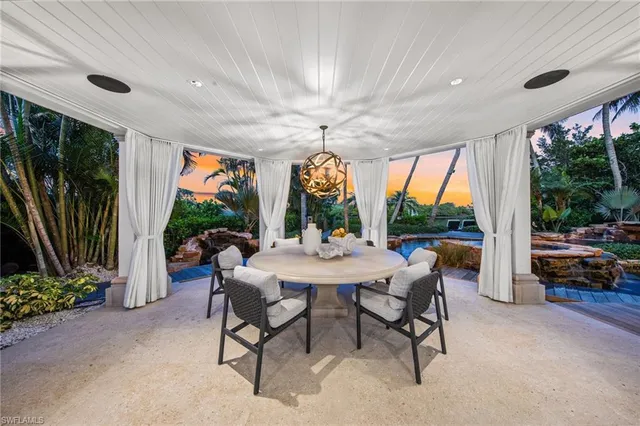 a house with swimming pool in front of it