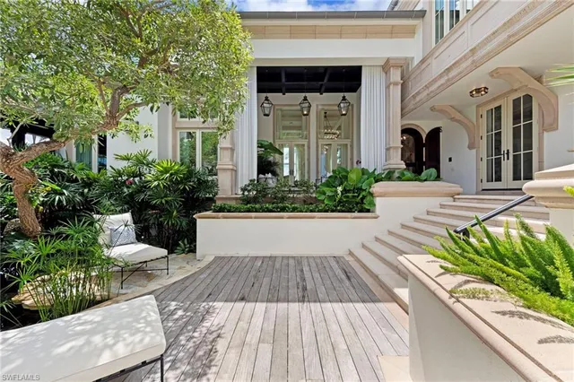 a view of a swimming pool with outdoor seating