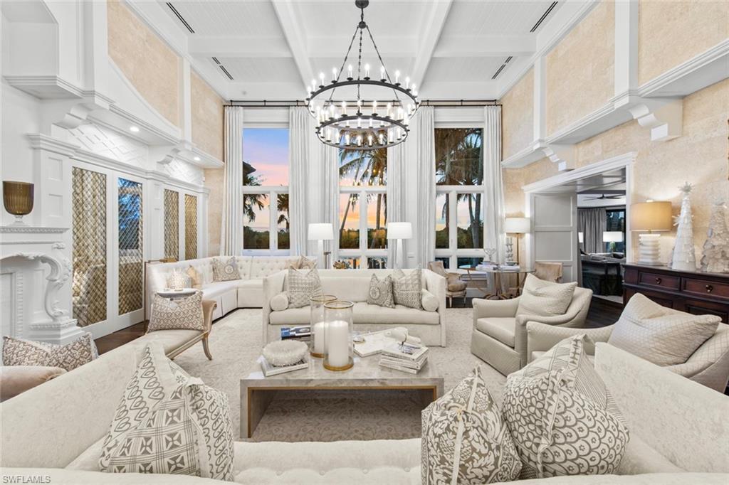 3675 Gordon Drive Naples, FL 34102 - Photo 4 of 50 a living room with furniture chandelier and a chandelier