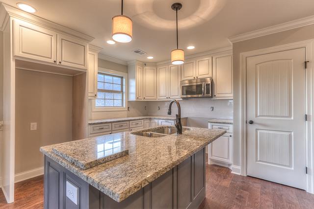 7 Bates Road Lebanon, TN 37087 - Photo 6 of 14 a kitchen with kitchen island granite countertop a sink a counter space appliances and cabinets