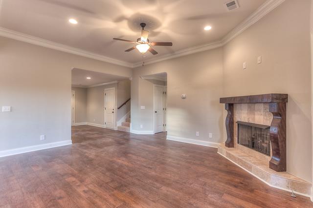 7 Bates Road Lebanon, TN 37087 - Photo 8 of 14 an empty room with a fireplace and fan