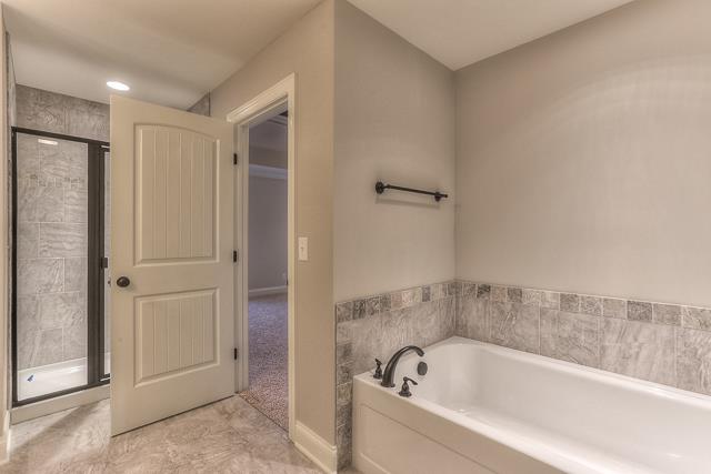 7 Bates Road Lebanon, TN 37087 - Photo 10 of 14 a bathroom with a bathtub and shower