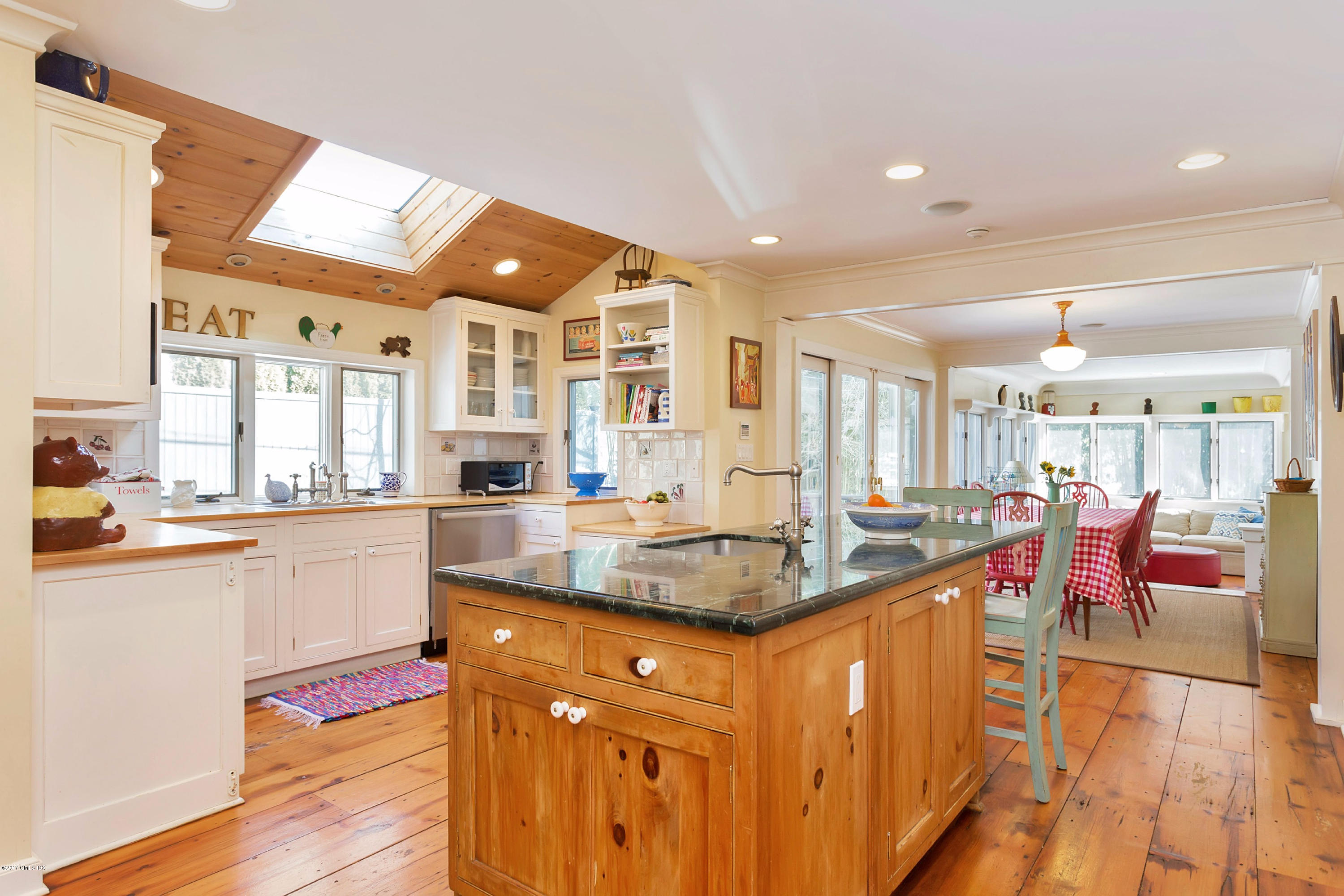 49 Gilliam Lane Riverside, CT 06878 - Photo 12 of 38 a dining hall with stainless steel appliances granite countertop a sink and view of living room