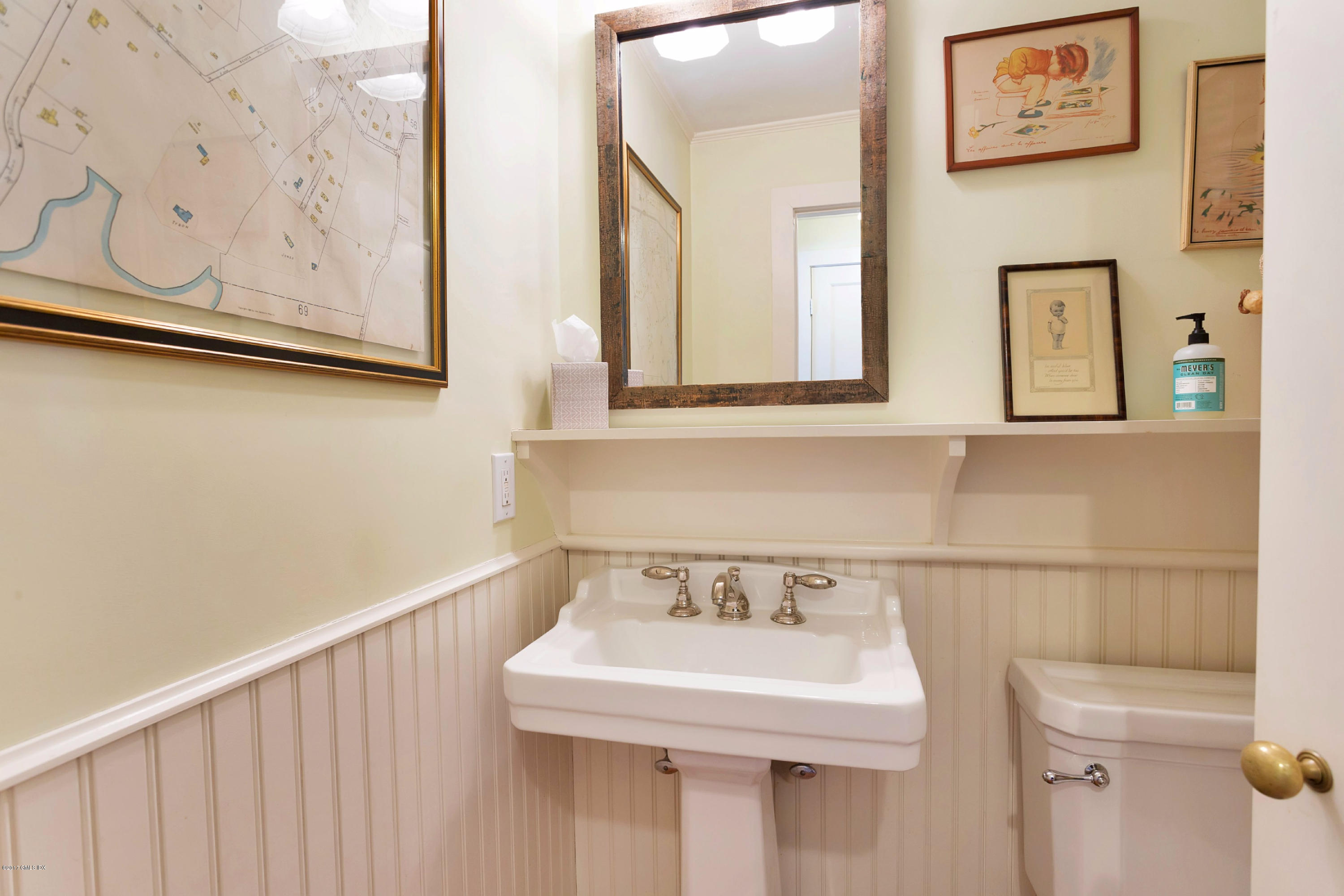 49 Gilliam Lane Riverside, CT 06878 - Photo 19 of 38 a bathroom with a sink and a mirror