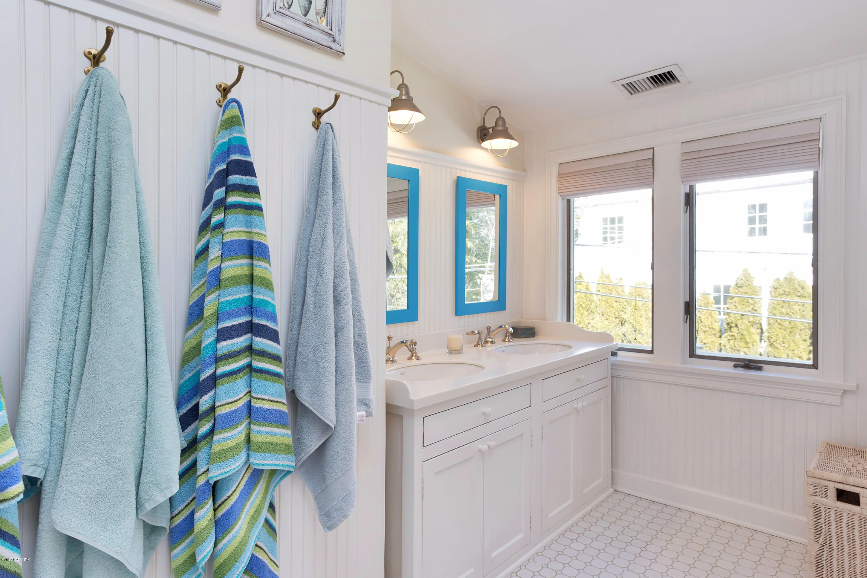 49 Gilliam Lane Riverside, CT 06878 - Photo 23 of 38 a bathroom with a sink a vanity and a shower