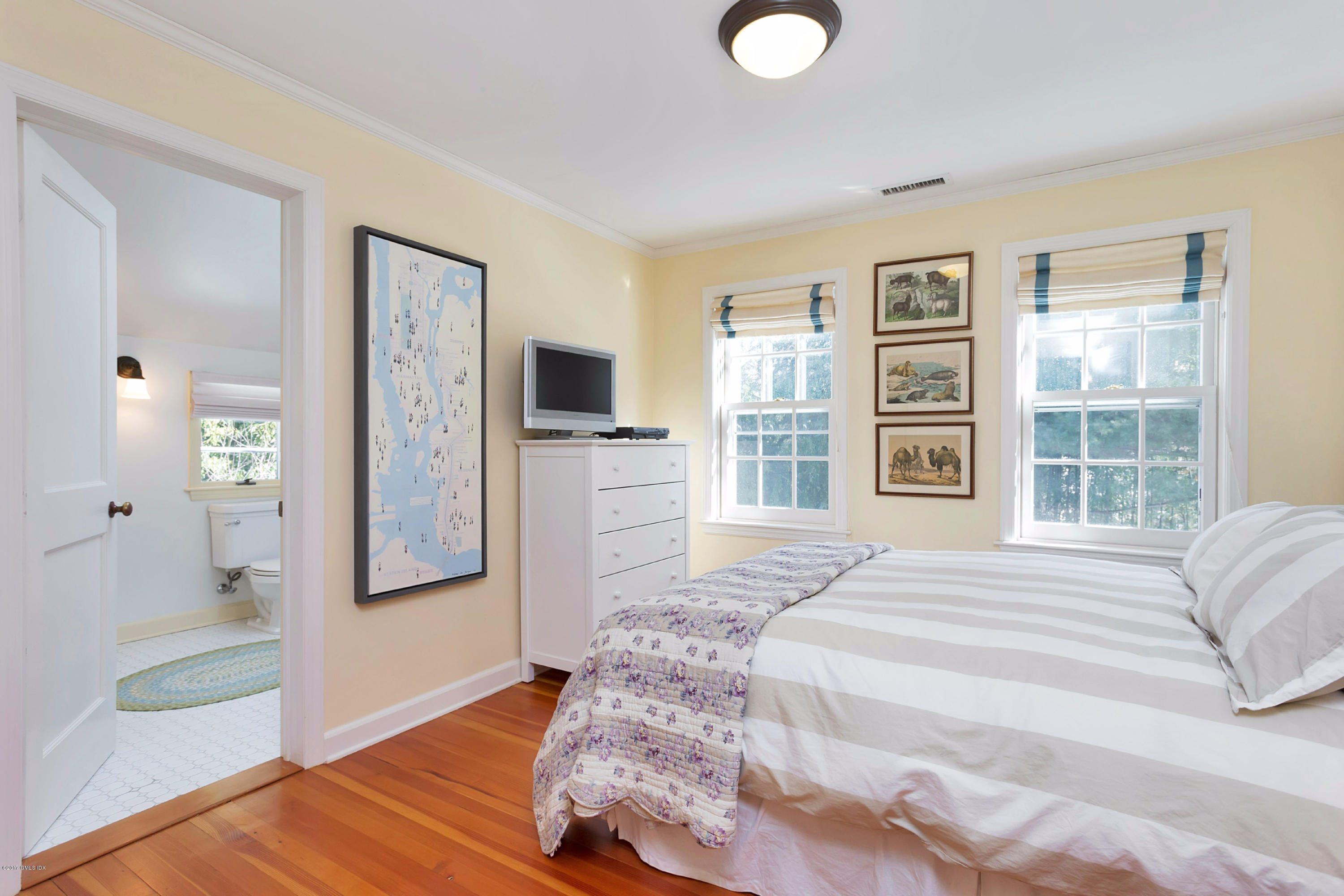 49 Gilliam Lane Riverside, CT 06878 - Photo 24 of 38 a spacious bedroom with a bed and a television