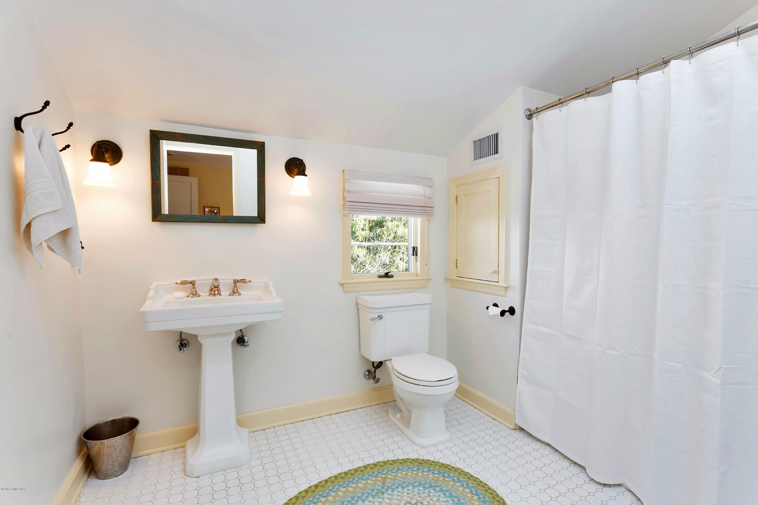 49 Gilliam Lane Riverside, CT 06878 - Photo 25 of 38 a bathroom with a sink a toilet and shower