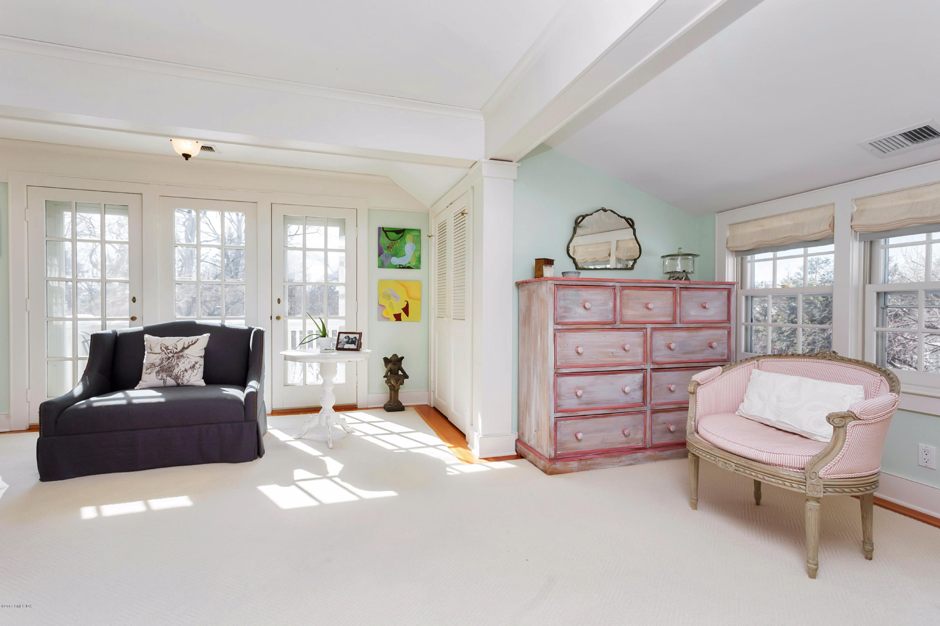 49 Gilliam Lane Riverside, CT 06878 - Photo 28 of 38 a spacious bedroom with a bed and a chair
