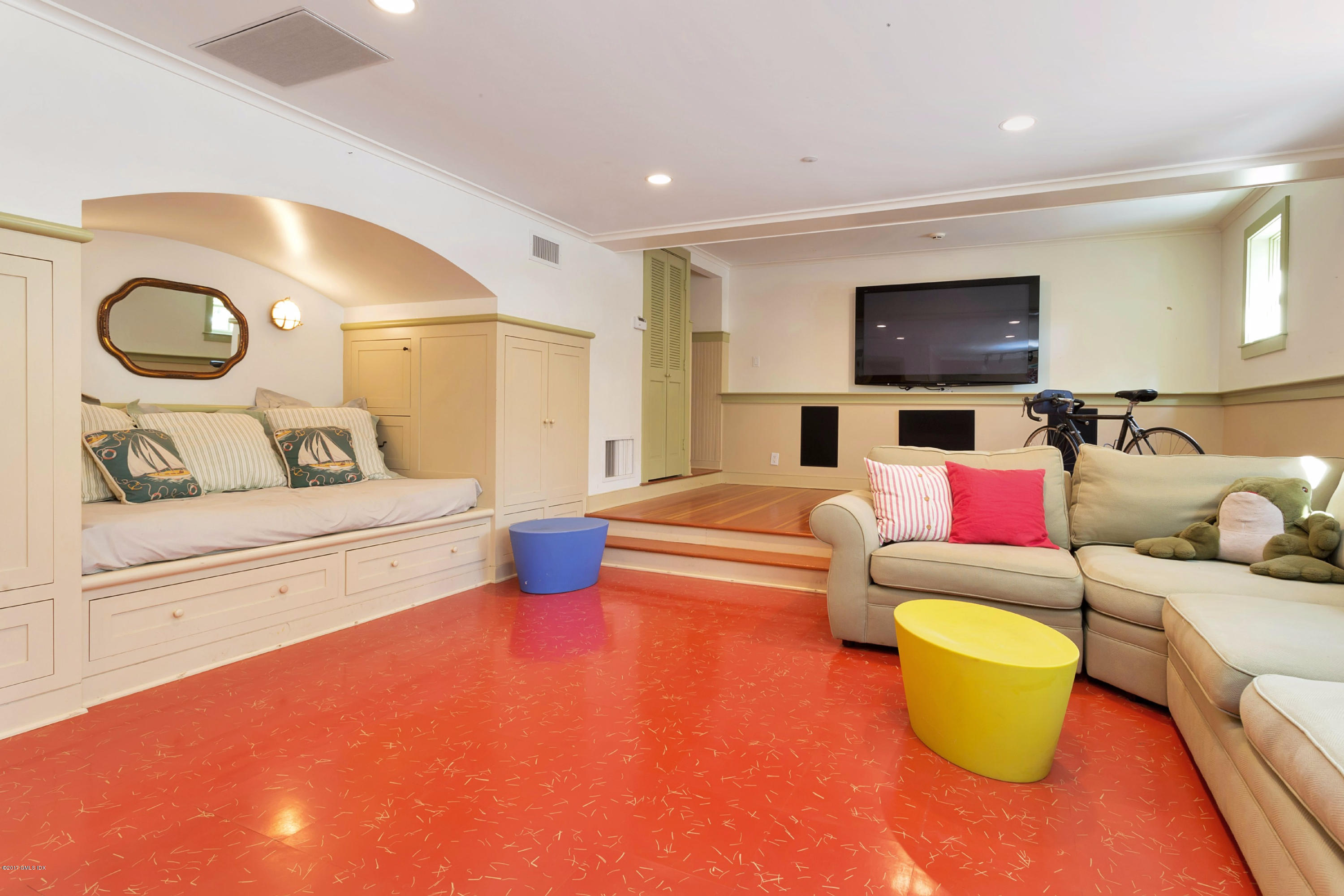 49 Gilliam Lane Riverside, CT 06878 - Photo 30 of 38 a living room with furniture and a flat screen tv