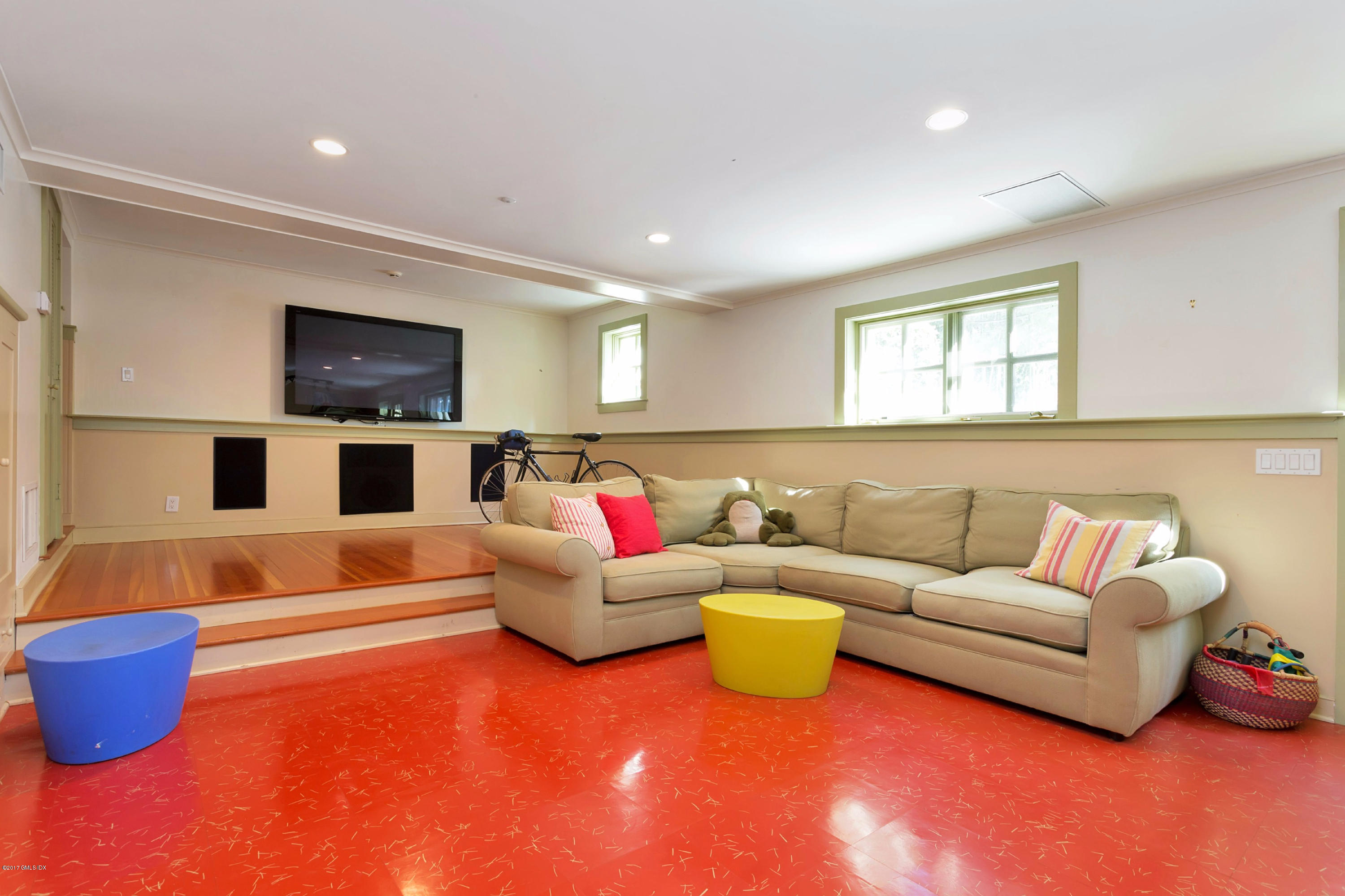 49 Gilliam Lane Riverside, CT 06878 - Photo 31 of 38 a living room with furniture and a flat screen tv