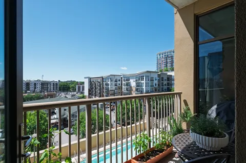 a view of a balcony with chair