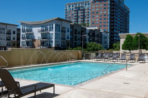 a view of a patio with a table and chairs