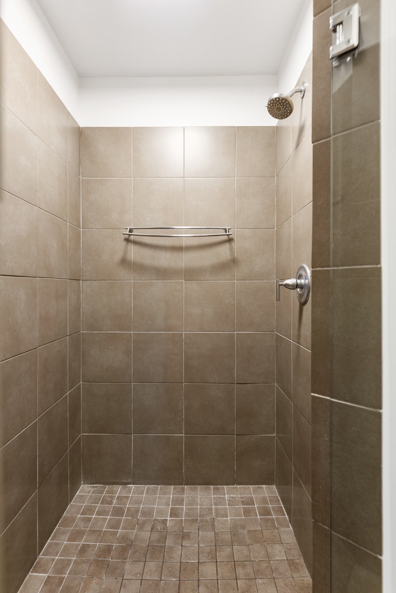 1510 Demonbreun Street, Unit 701 Nashville, TN 37203 - Photo 9 of 22 a bathroom with a shower