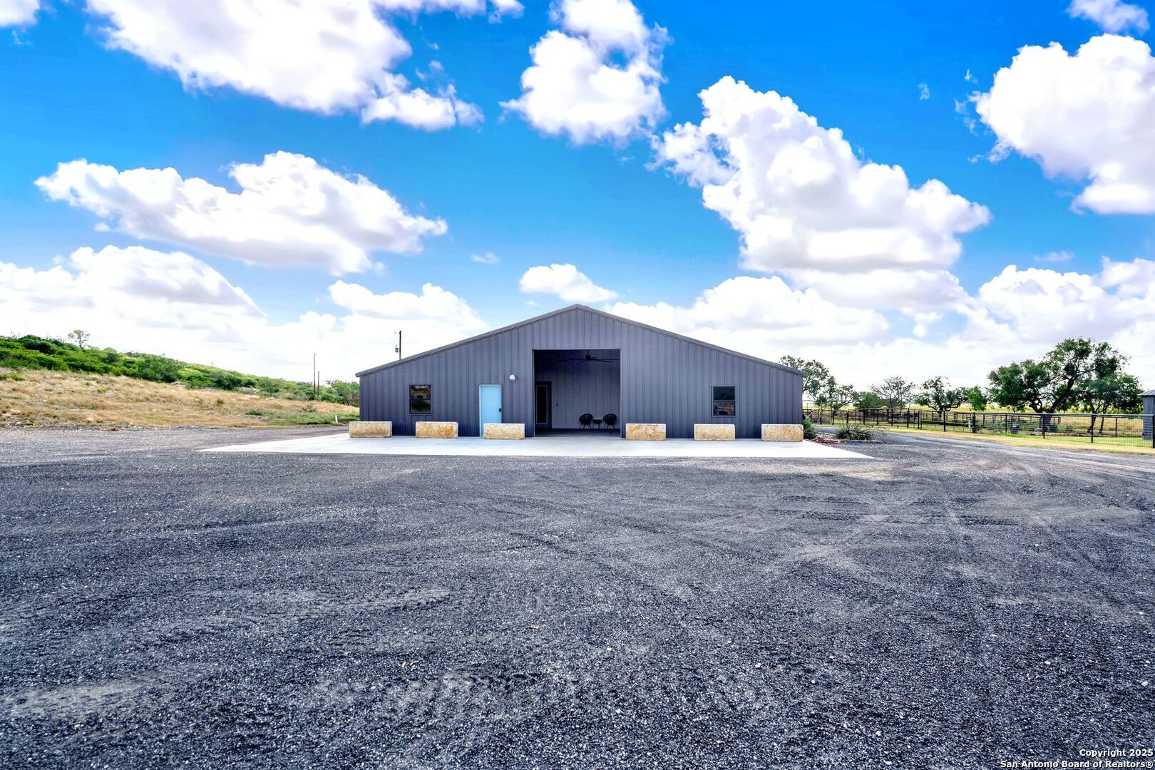 722 County Road 424 Hondo, TX 78861 - Photo 16 of 45 a view of a house with a yard