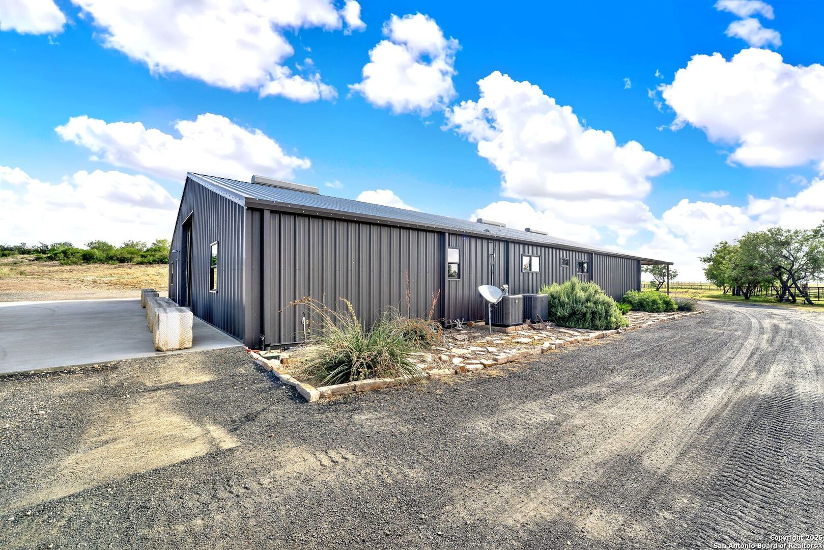 722 County Road 424 Hondo, TX 78861 - Photo 19 of 45 a view of a backyard of a house