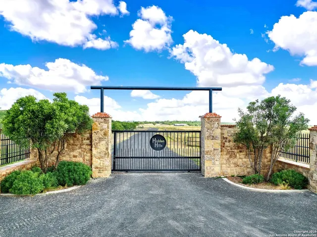 a view of a porch with a floor to ceiling window and wooden fence