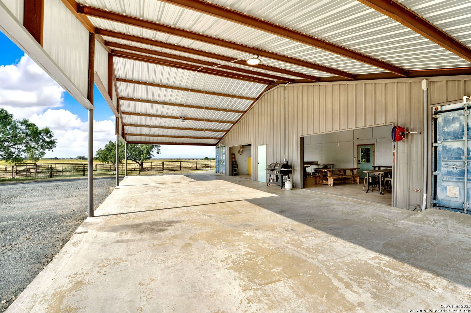 722 County Road 424 Hondo, TX 78861 - Photo 27 of 45 a bedroom with a bed and large window with balcony view