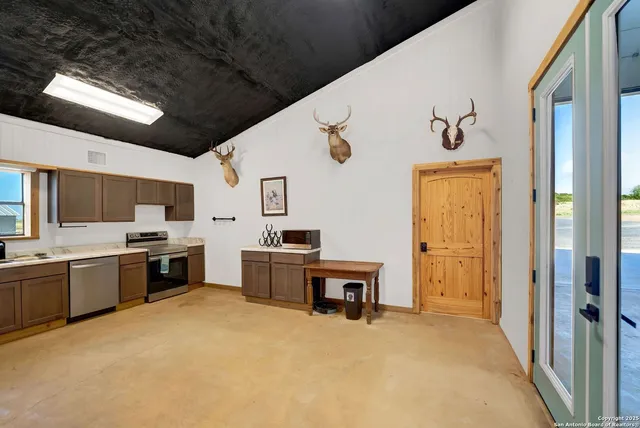 a work room with table and chairs