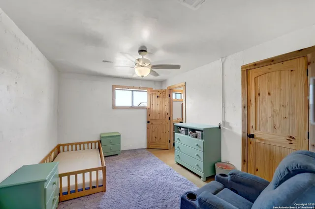 a living room with fireplace furniture and a fireplace