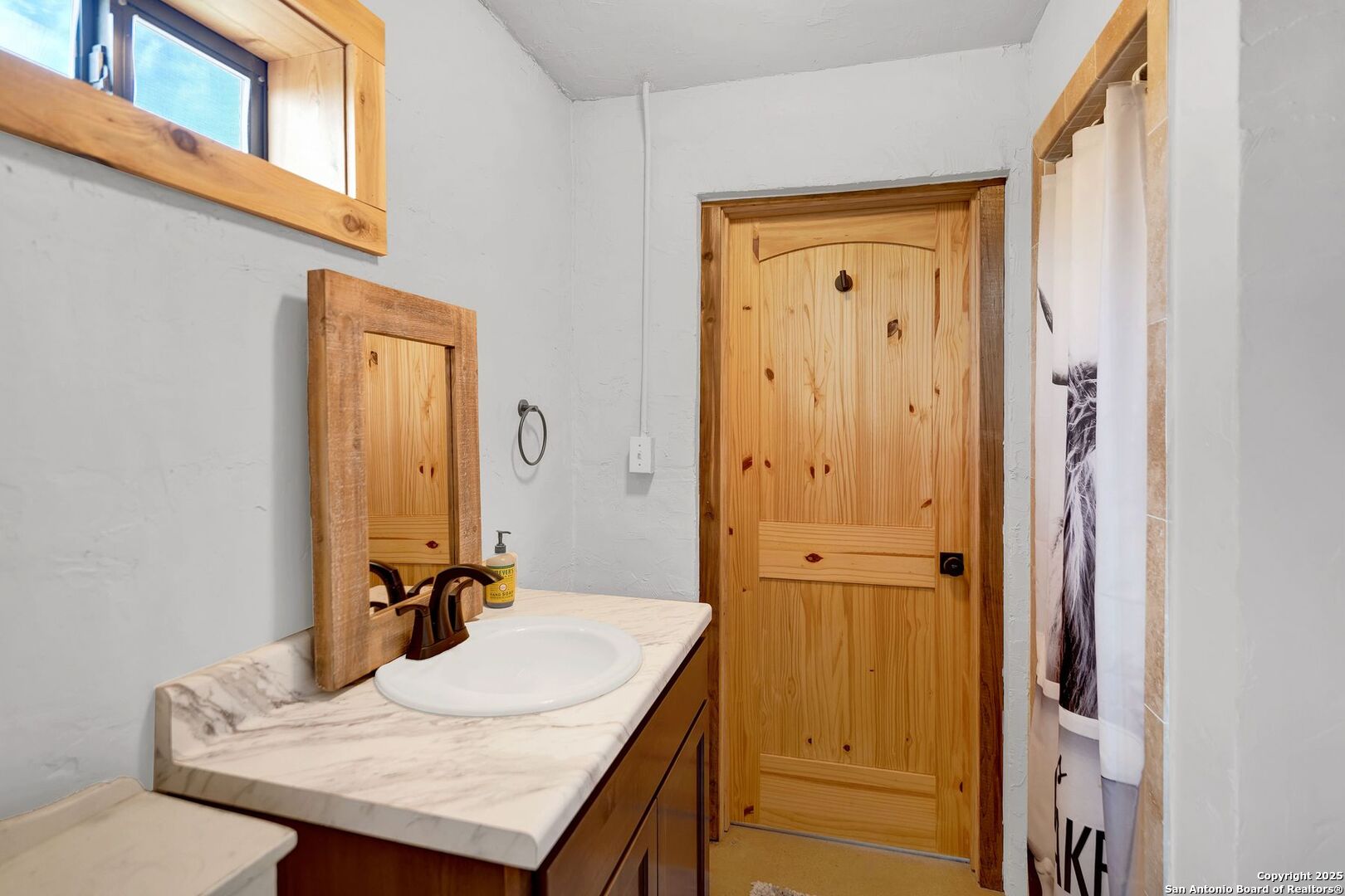 722 County Road 424 Hondo, TX 78861 - Photo 39 of 45 a bathroom with a granite countertop sink and a mirror