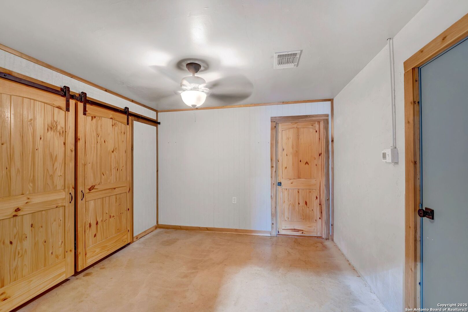 722 County Road 424 Hondo, TX 78861 - Photo 43 of 45 a view of a livingroom with a chandelier fan and wooden floor