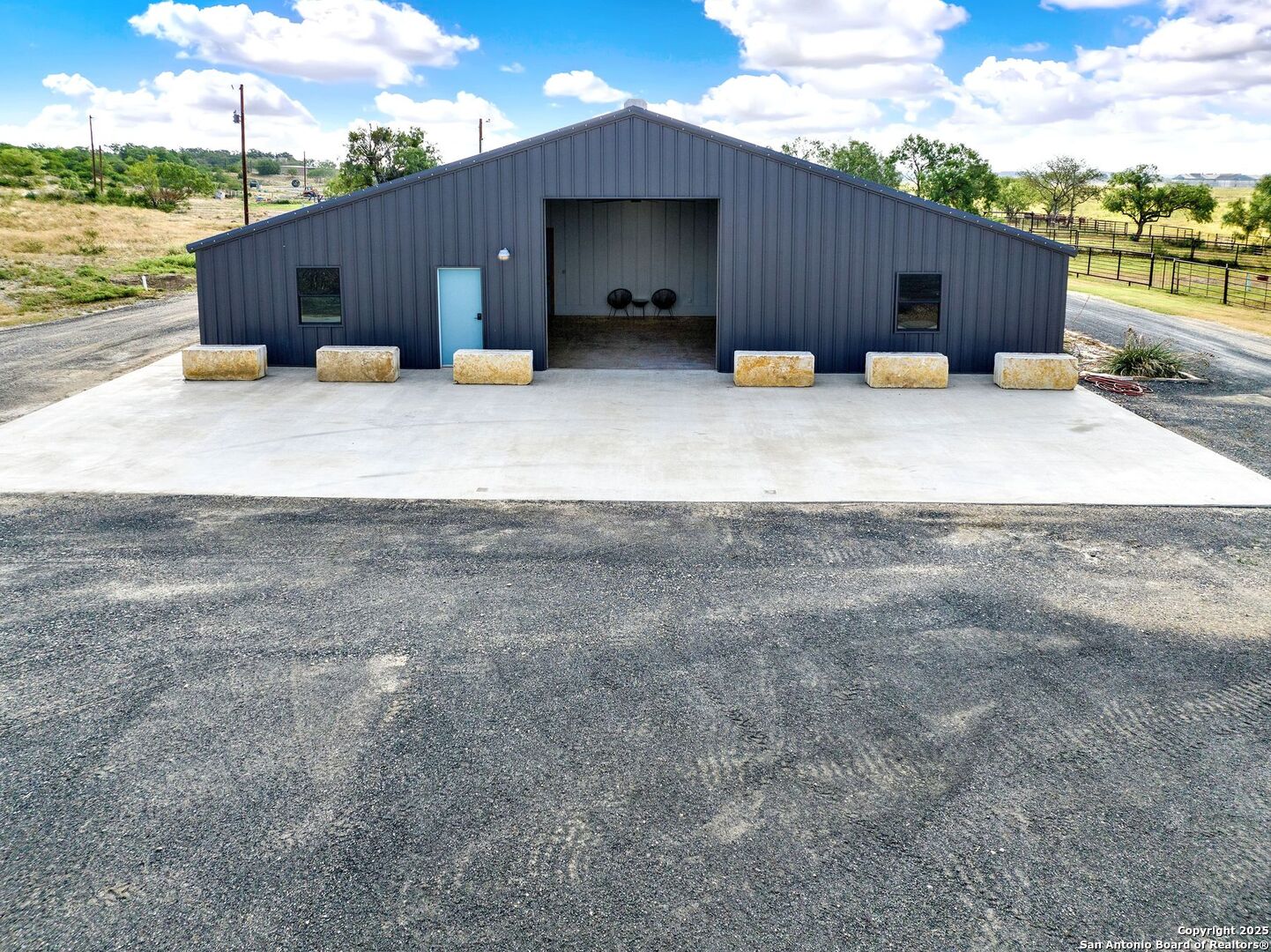 722 County Road 424 Hondo, TX 78861 - Photo 8 of 45 a view of a house with wooden fence next to a yard