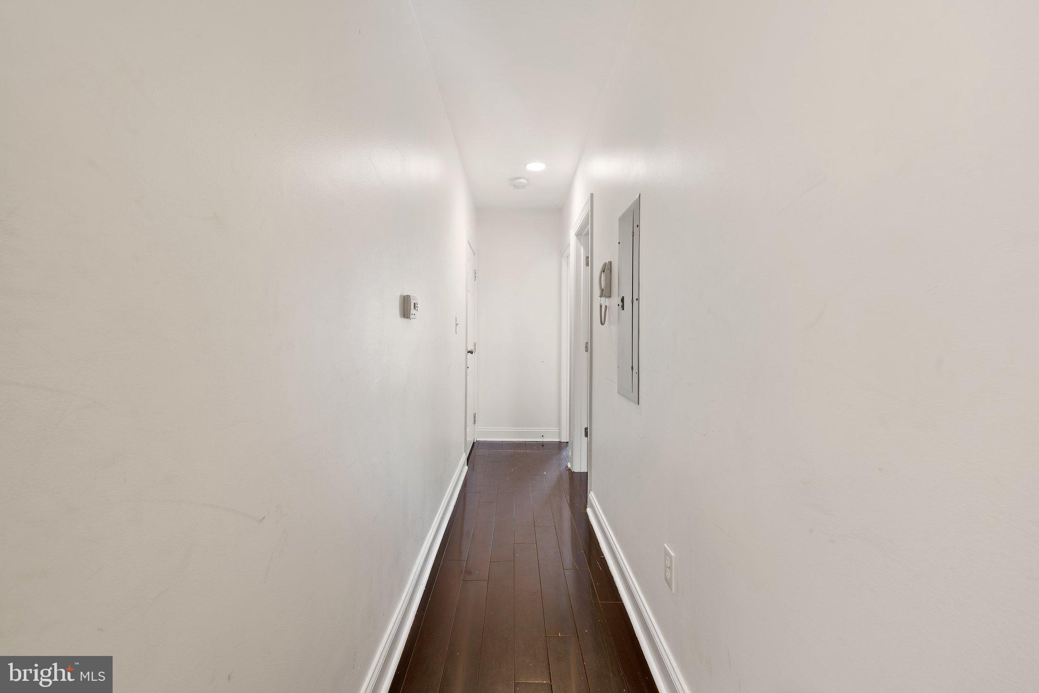 1729 Fontain Street, Unit 1 Philadelphia, PA 19121 - Photo 11 of 25 a view of a hallway with wooden floor