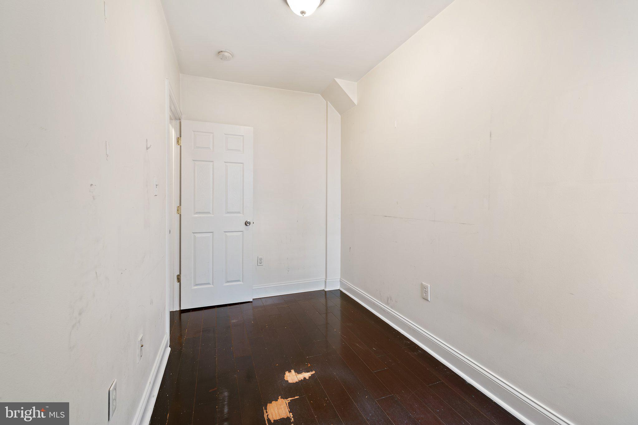 1729 Fontain Street, Unit 1 Philadelphia, PA 19121 - Photo 14 of 25 an empty room with wooden floor and closet