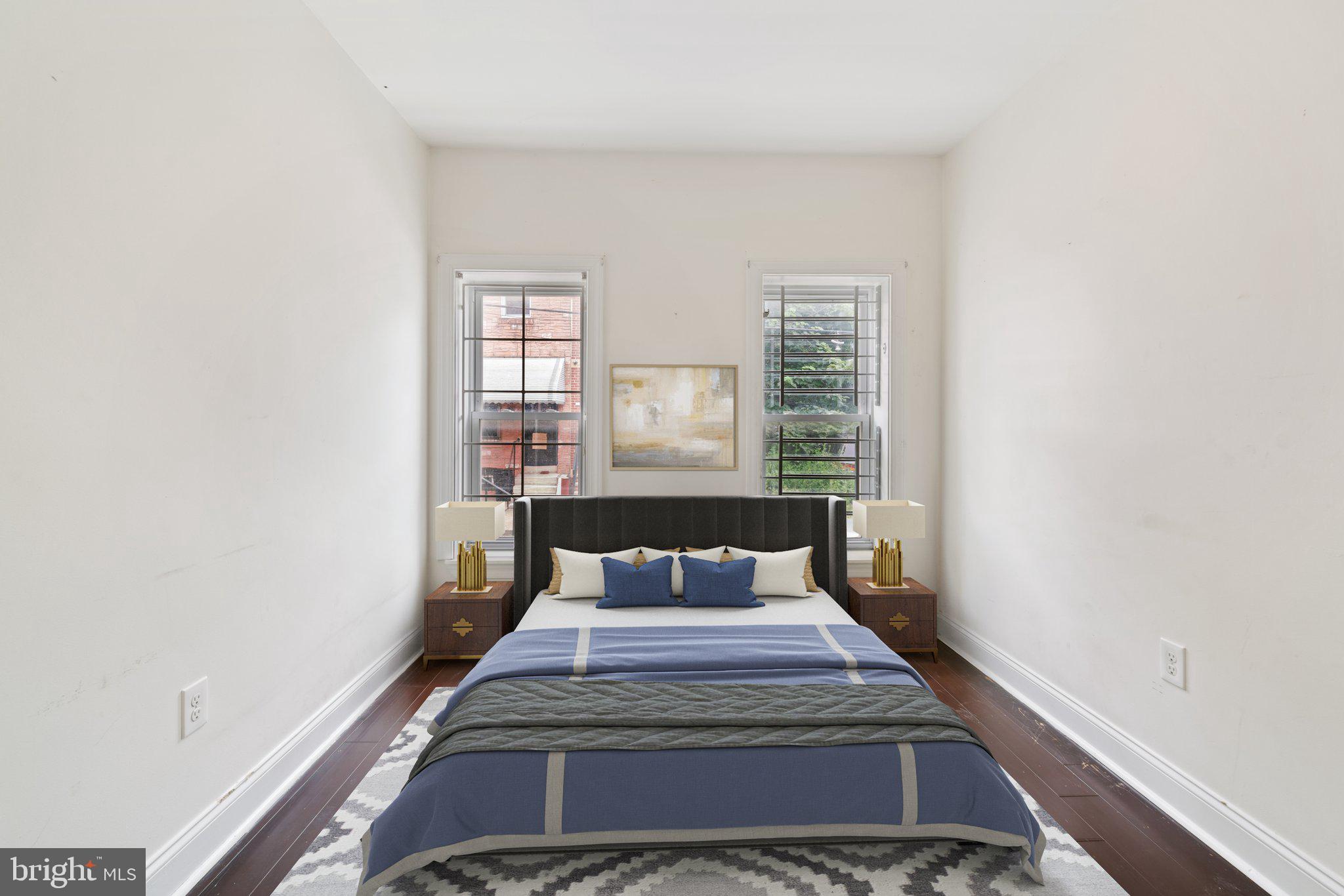 1729 Fontain Street, Unit 1 Philadelphia, PA 19121 - Photo 7 of 25 a bed sitting in a bedroom next to a window