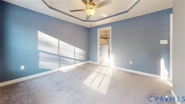 a view of an empty room and a window