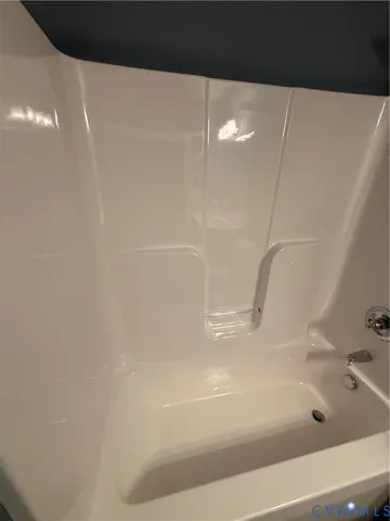 a bathroom with a sink a toilet and bathtub